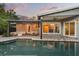 Beautiful backyard pool with covered patio, outdoor dining, and access to the home's interior at 2918 Wessex St, Orlando, FL 32803
