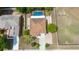 Aerial view of a two-story house featuring an in-ground pool and a long driveway at 294 Hunt St, Clermont, FL 34711