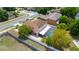 Aerial view of a two-story house featuring an in-ground pool and a long driveway at 294 Hunt St, Clermont, FL 34711
