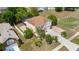 Aerial view of a two-story house with a long driveway and well-maintained landscaping at 294 Hunt St, Clermont, FL 34711