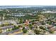Serene aerial view of a neighborhood, showcasing houses near lakes and lush green spaces, creating a peaceful setting at 294 Hunt St, Clermont, FL 34711