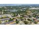 Aerial shot highlighting a residential area with a lake, offering a scenic view of the community and its surroundings at 294 Hunt St, Clermont, FL 34711