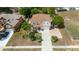 Aerial view of a two-story house with a long driveway and well-maintained landscaping at 294 Hunt St, Clermont, FL 34711