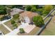 Aerial view of a two-story house with a long driveway and well-maintained landscaping at 294 Hunt St, Clermont, FL 34711