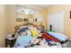 Bedroom featuring a large mirror, and closet at 294 Hunt St, Clermont, FL 34711