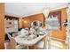 Elegant dining room featuring decorative chandelier, neutral walls, hardwood floors and formal dining set at 294 Hunt St, Clermont, FL 34711