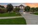 Charming two-story home with lush landscaping, palm trees, and a spacious driveway at 294 Hunt St, Clermont, FL 34711