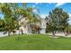Beautiful home with lush landscaping and mature trees in a serene setting at 294 Hunt St, Clermont, FL 34711