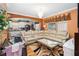 Open-concept space with kitchen view and comfortable white leather sectional sofa at 294 Hunt St, Clermont, FL 34711
