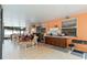 A covered patio with an outdoor kitchen featuring wood cabinets and a grill at 294 Hunt St, Clermont, FL 34711