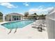 Community pool featuring lounge chairs, showers, and a covered gathering area at 294 Hunt St, Clermont, FL 34711