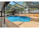 Enclosed pool with spa and plenty of seating for guests at 294 Hunt St, Clermont, FL 34711