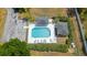 Aerial view of community pool, showcasing the pool's layout, lounge chairs, and surrounding landscaping at 294 Hunt St, Clermont, FL 34711