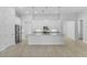 Bright, open kitchen with large island, granite countertops, stainless steel appliances, and tile flooring at 354 Miller Rd, Sanford, FL 32773