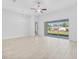 Bright and airy living room with tile floors and sliding glass doors to outdoor view at 354 Miller Rd, Sanford, FL 32773