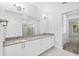 Bathroom featuring double vanity, granite countertops, and a glass-enclosed shower at 371 Miller Rd, Sanford, FL 32773