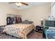 This bedroom features a ceiling fan, carpet, and closet for ample storage space at 3842 Klondike Pl, Sanford, FL 32771