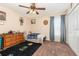 Cozy bedroom features a ceiling fan, window with curtains, and a closet for ample storage space at 3842 Klondike Pl, Sanford, FL 32771