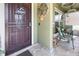Inviting front porch featuring decorative accents, tiled flooring and a seating area at 3842 Klondike Pl, Sanford, FL 32771