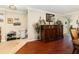 Elegant living room with hardwood floors and a decorative wooden console table at 3842 Klondike Pl, Sanford, FL 32771