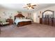 Large main bedroom with ample space, wooden furniture and a ceiling fan at 3842 Klondike Pl, Sanford, FL 32771