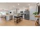 Modern kitchen with stainless steel appliances, white cabinets, and an island at 393 Meadowland Pt, Oviedo, FL 32765