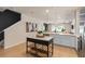 Open-concept kitchen with a central island, perfect for entertaining and gatherings at 393 Meadowland Pt, Oviedo, FL 32765