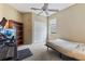 Bedroom featuring neutral carpet, ceiling fan, and white closet doors at 4813 River Gem Ave, Windermere, FL 34786