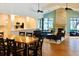 Bright community room with full kitchen, living area with fireplace, and dining space, all with lake views at 4813 River Gem Ave, Windermere, FL 34786