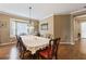 Traditional dining room with wood floors, chandelier, and bay window letting in lots of natural light at 4813 River Gem Ave, Windermere, FL 34786