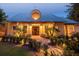 Community building exterior with attractive entrance, decorative window feature, and well-maintained landscaping at 4813 River Gem Ave, Windermere, FL 34786
