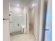 Modern bathroom featuring a walk-in shower with a glass door, a tiled seat, and a private toilet at 5158 Gardenrow Dr, St Cloud, FL 34772