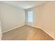 Bright bedroom with wood-look floors and window provides a comfortable retreat at 5158 Gardenrow Dr, St Cloud, FL 34772