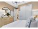 Bright bedroom with a large dresser, slider closet doors, and neutral colors that create a calming atmosphere at 5158 Gardenrow Dr, St Cloud, FL 34772