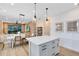 Open-concept design features dining area connecting to kitchen and living room, with natural light at 5158 Gardenrow Dr, St Cloud, FL 34772