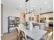Open concept space with dining area flowing into the kitchen featuring stainless steel appliances at 5158 Gardenrow Dr, St Cloud, FL 34772