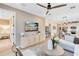 Bright living room boasts a ceiling fan, sleek furniture, and an open layout with modern design elements throughout at 5158 Gardenrow Dr, St Cloud, FL 34772