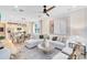 Open-concept living area with modern furnishings, a view into the kitchen, and stylish decor for comfortable living at 5158 Gardenrow Dr, St Cloud, FL 34772