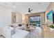 Bright and airy living room with modern decor, comfortable seating, and view of the outdoor area with a pool at 5158 Gardenrow Dr, St Cloud, FL 34772