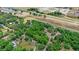 An aerial view of a home with a vast tree coverage. The image also includes a speedway and a highway at 549 Wellon Ave, Orlando, FL 32833