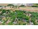 An aerial view of a home with a vast tree coverage. The image also includes a speedway and a highway at 549 Wellon Ave, Orlando, FL 32833