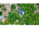 Aerial view of a home nestled among dense trees with a long winding driveway at 549 Wellon Ave, Orlando, FL 32833