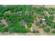An aerial view of a home with a vast tree coverage. The image also includes a speedway and a highway at 549 Wellon Ave, Orlando, FL 32833