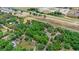 Beautiful birds-eye view showing property lines, lush greenery, and serene location next to a speedway at 549 Wellon Ave, Orlando, FL 32833