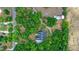 Aerial view of a home nestled among dense trees with a winding driveway at 549 Wellon Ave, Orlando, FL 32833