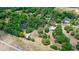 An aerial view of a home with a vast tree coverage. The image also includes a speedway and a highway at 549 Wellon Ave, Orlando, FL 32833