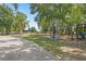 Expansive backyard featuring a grill, playground, and partially fenced area at 549 Wellon Ave, Orlando, FL 32833