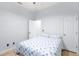 This is a bedroom featuring neutral walls, a fan, and patterned bedding at 549 Wellon Ave, Orlando, FL 32833