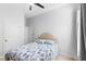 This bedroom has a ceiling fan, neutral walls, and a comfortable bed with a patterned cover at 549 Wellon Ave, Orlando, FL 32833