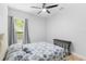 Cozy bedroom showcasing natural light, a ceiling fan, and simple furnishings at 549 Wellon Ave, Orlando, FL 32833